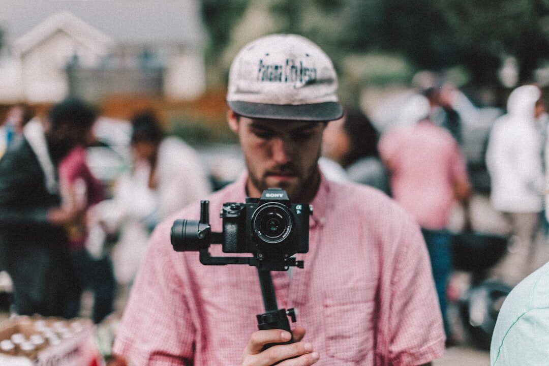 Journalist filming a street report with a smartphone on a gimbal